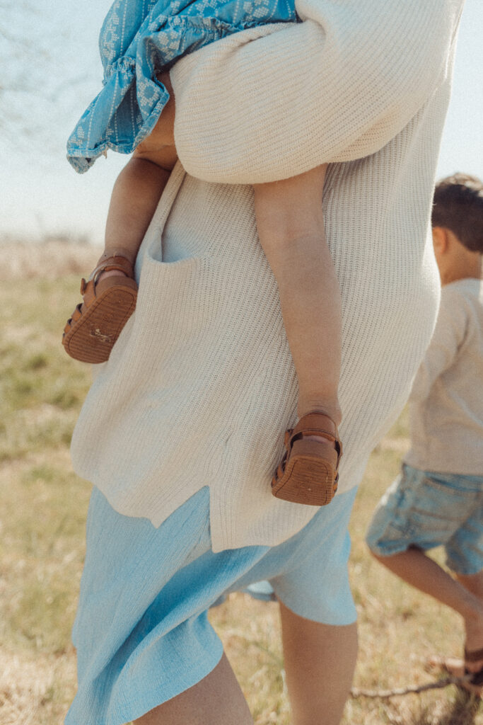 mother holds child during a mini session in Lawton, OK