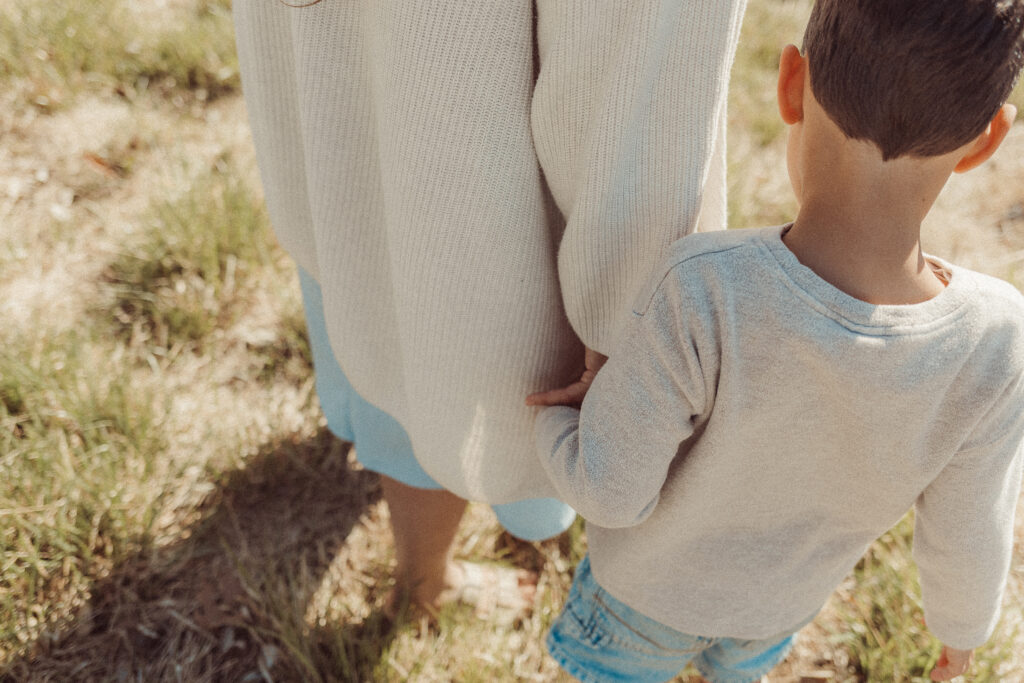 mother holds son's hand during mini session in Lawton, OK