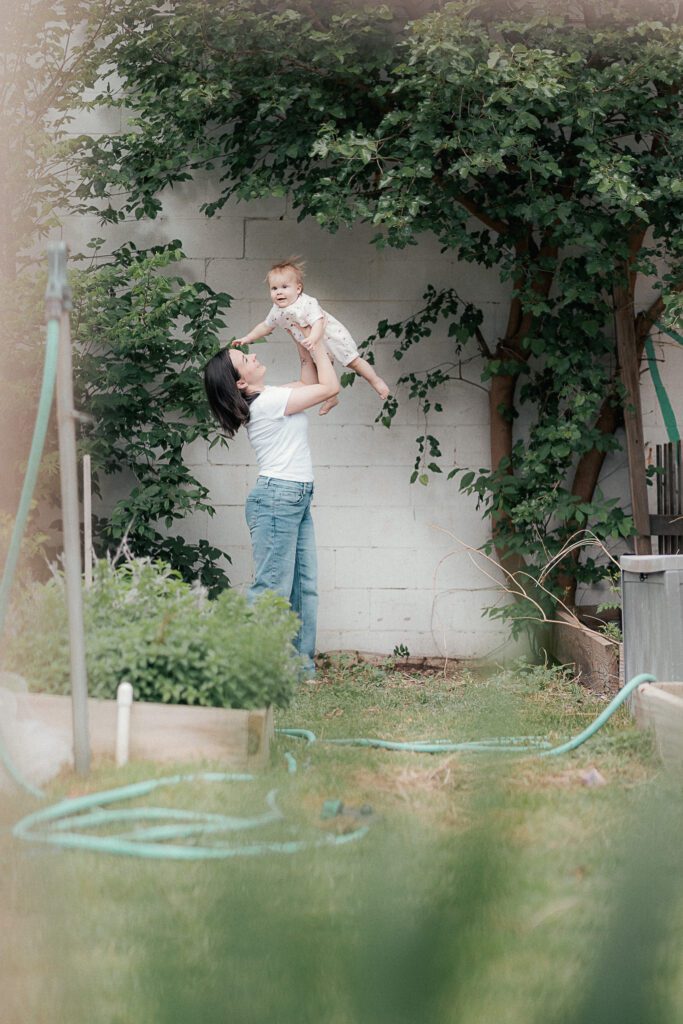 mother plays with her child during a mother's day mini session in lawton, OK