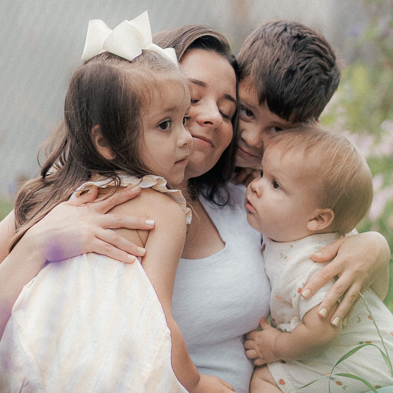 mom embraces her children during mother's day mini session in lawton, ok